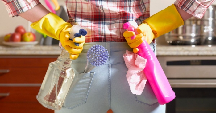Woman with cleaning products