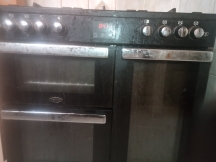 Greasy oven front before being cleaned