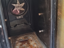 Narrow oven with no shelves and door open before being cleaned